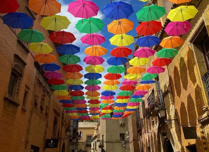 Umbrellas on a street at Poble Espanyol